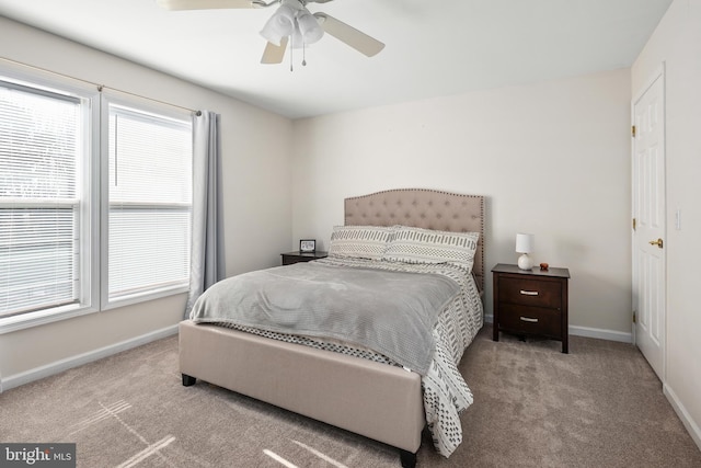 bedroom featuring a ceiling fan, baseboards, and carpet flooring