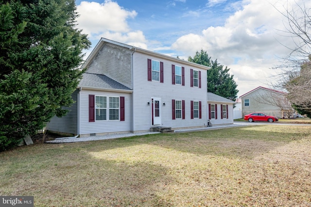 colonial house featuring roof with shingles, a front lawn, and crawl space