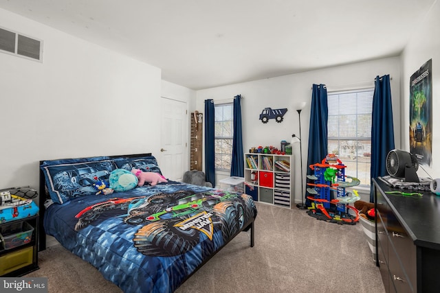 bedroom featuring carpet floors and visible vents