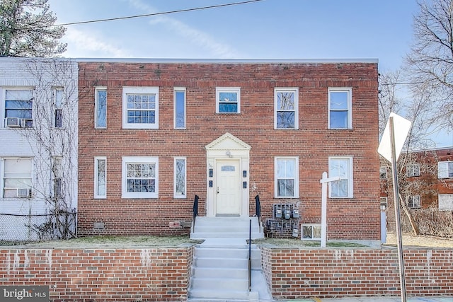 view of property with brick siding