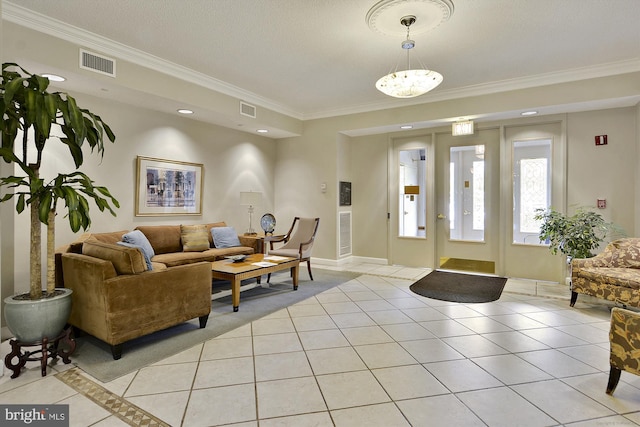 interior space featuring light tile patterned floors, visible vents, and crown molding