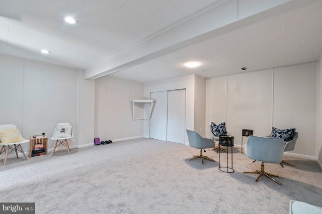 living area with baseboards, beamed ceiling, carpet, and recessed lighting