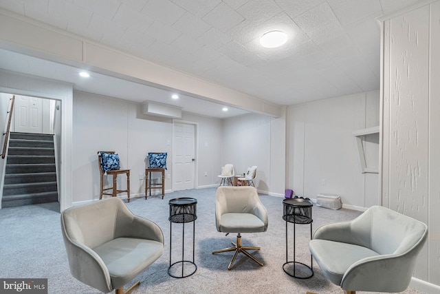 living area with carpet floors, stairs, baseboards, and recessed lighting