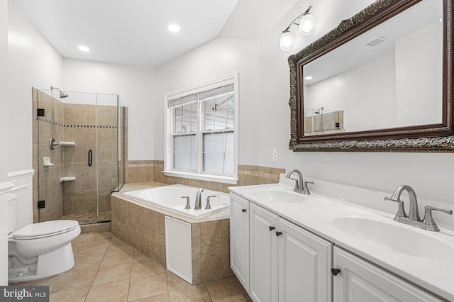 bathroom with a stall shower, visible vents, a sink, and tile patterned floors