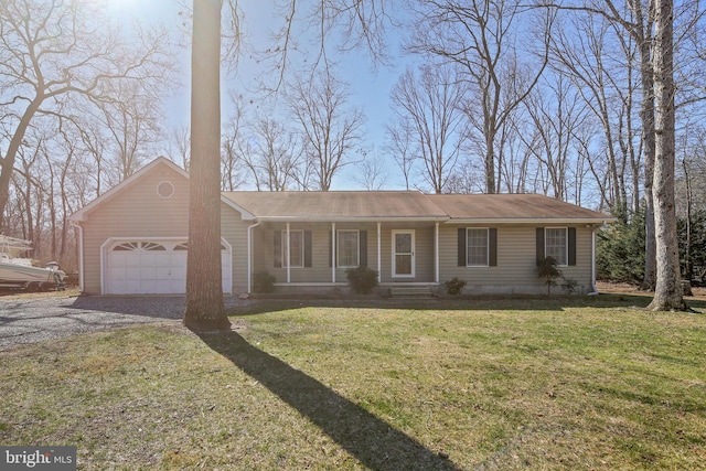 single story home featuring a garage, a front yard, and driveway