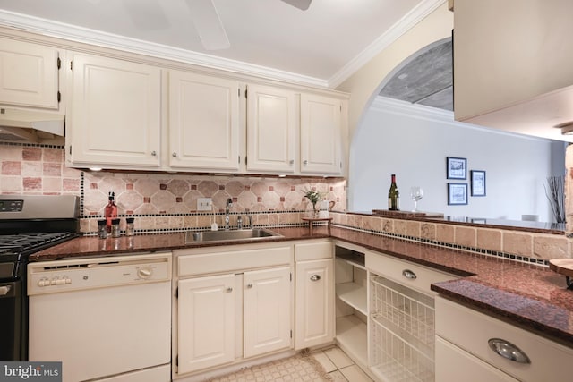 kitchen with white dishwasher, crown molding, under cabinet range hood, a sink, and gas stove