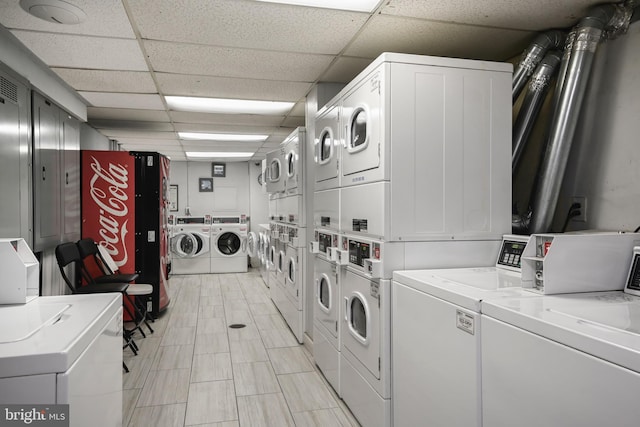 community laundry room with stacked washer / dryer and independent washer and dryer