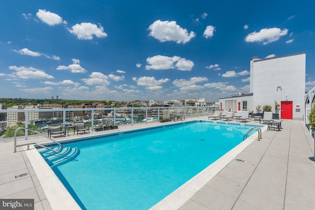 community pool with a patio area