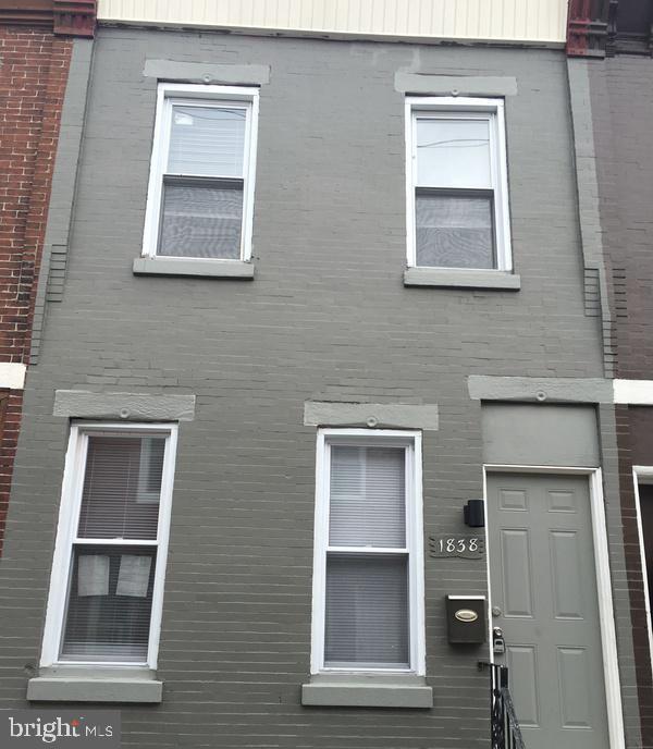 view of front of home featuring brick siding