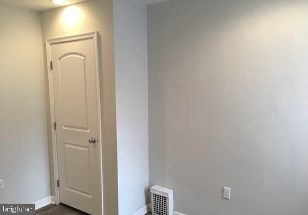 interior space with visible vents and baseboards