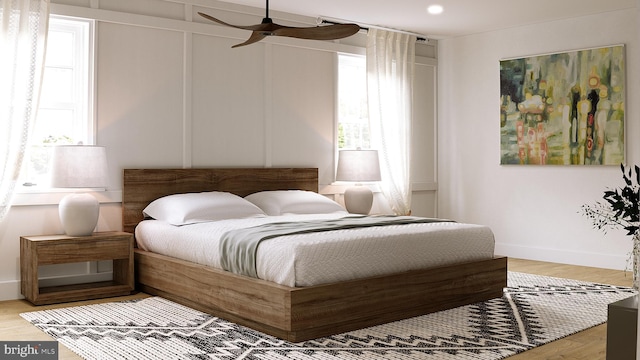 bedroom with recessed lighting, wood finished floors, a ceiling fan, and baseboards