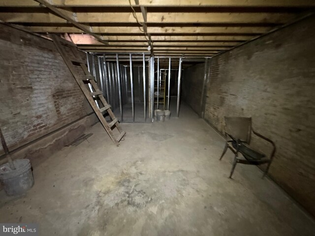 unfinished basement with brick wall