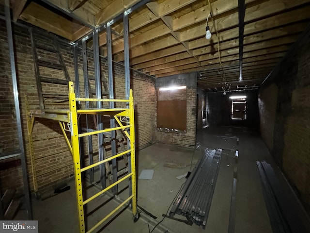 unfinished basement with brick wall