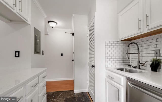 kitchen featuring electric panel, baseboards, dishwasher, crown molding, and a sink