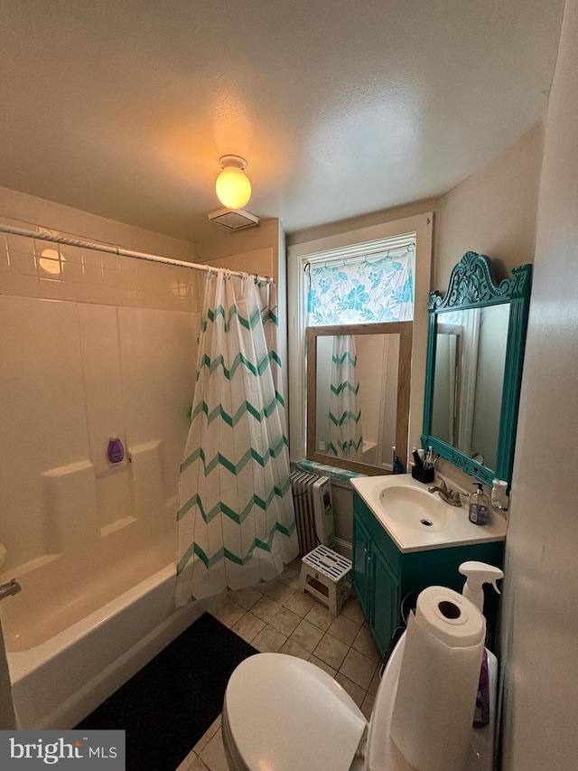 bathroom featuring toilet, visible vents, vanity, tile patterned floors, and radiator