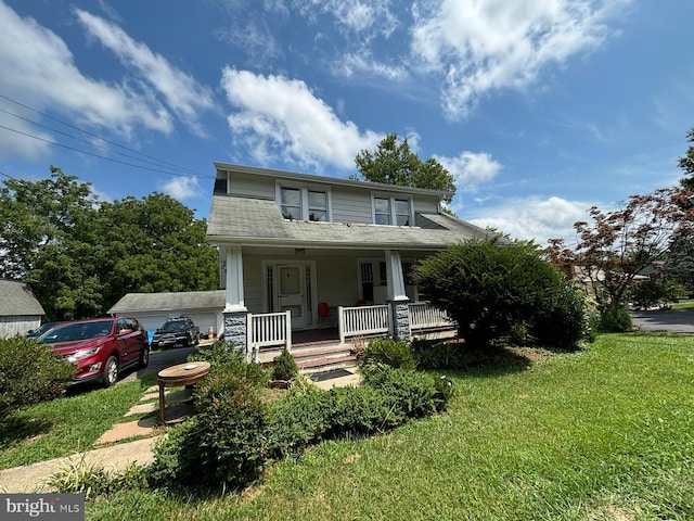 view of front of property with covered porch and a front lawn