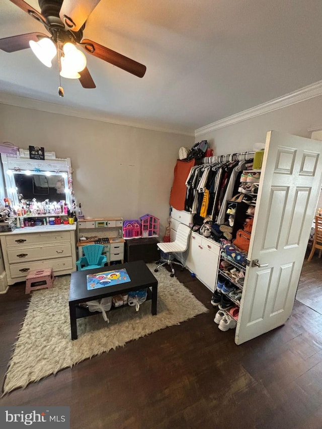 interior space featuring crown molding and wood finished floors