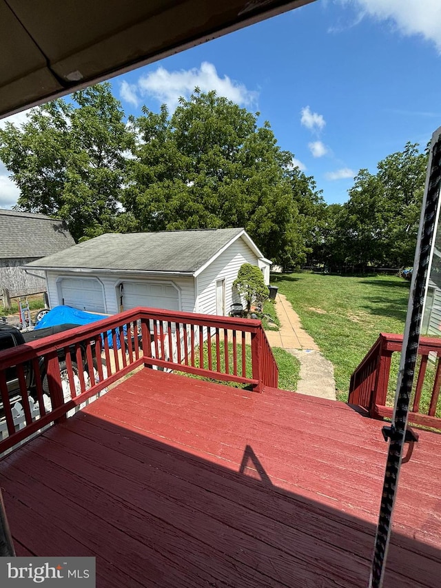 wooden deck featuring a yard