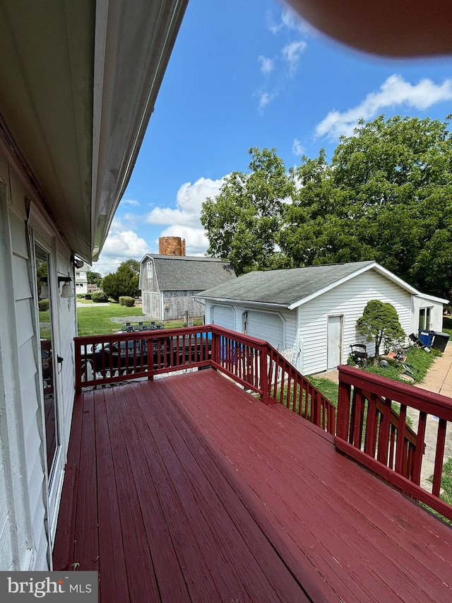 wooden terrace with an outdoor structure