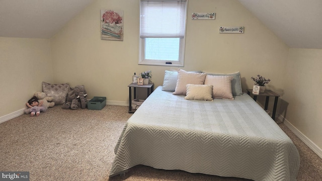 bedroom featuring vaulted ceiling, carpet floors, and baseboards