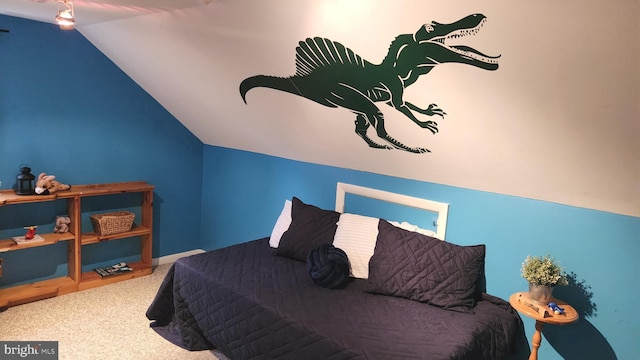 carpeted bedroom featuring vaulted ceiling