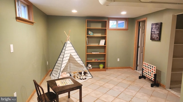 playroom with light tile patterned floors, baseboards, and recessed lighting