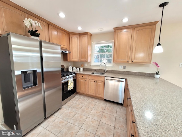 kitchen with light tile patterned flooring, recessed lighting, under cabinet range hood, a sink, and appliances with stainless steel finishes