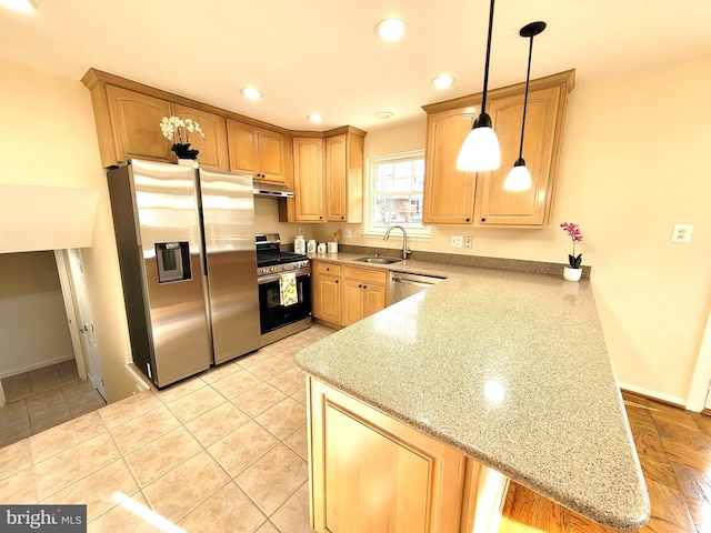 kitchen featuring recessed lighting, under cabinet range hood, stainless steel appliances, a peninsula, and a sink