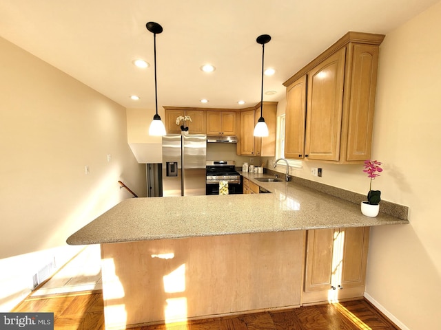 kitchen featuring stainless steel appliances, a sink, a peninsula, and light stone counters