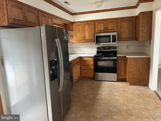 kitchen with visible vents, appliances with stainless steel finishes, brown cabinets, and light countertops