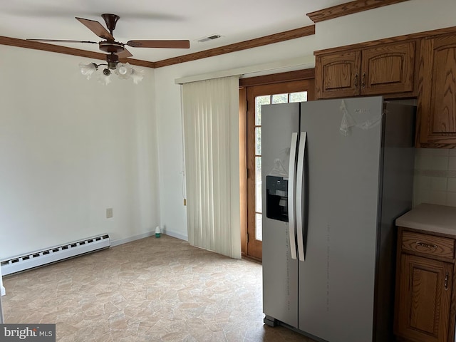 kitchen featuring stainless steel fridge, visible vents, a baseboard radiator, ceiling fan, and crown molding