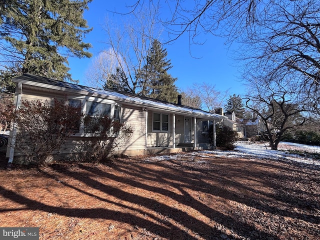 view of property exterior featuring a porch