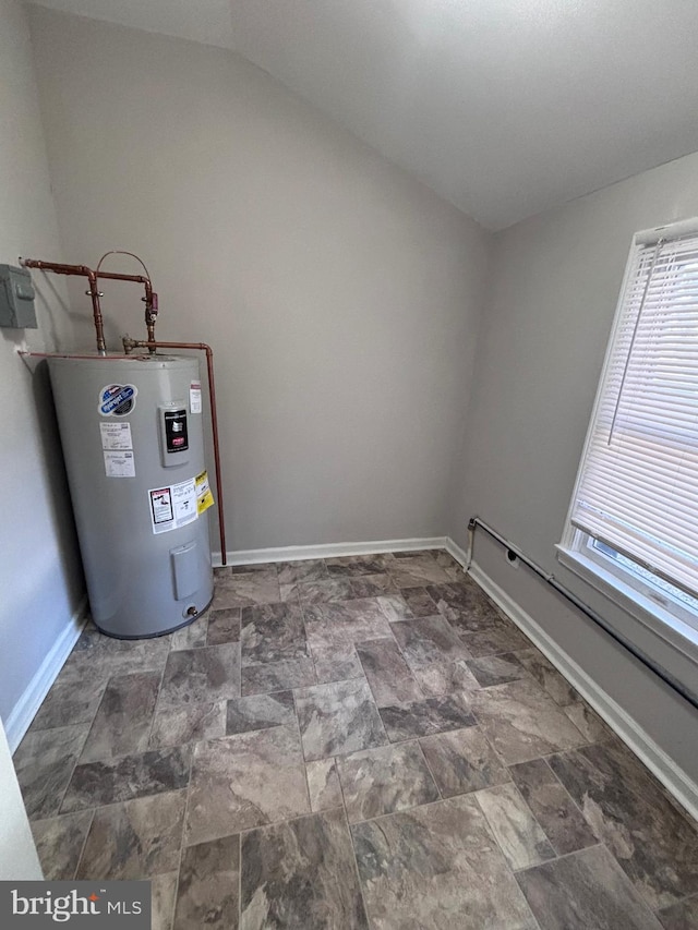 utility room featuring a baseboard radiator and water heater