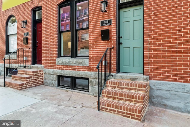 property entrance with brick siding