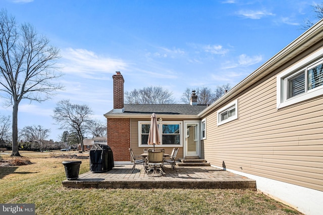 exterior space with entry steps, a yard, a chimney, and a patio area