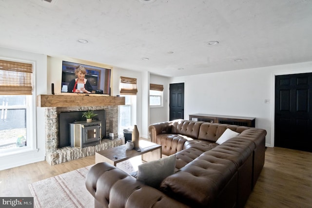 living area featuring plenty of natural light, wood finished floors, and recessed lighting