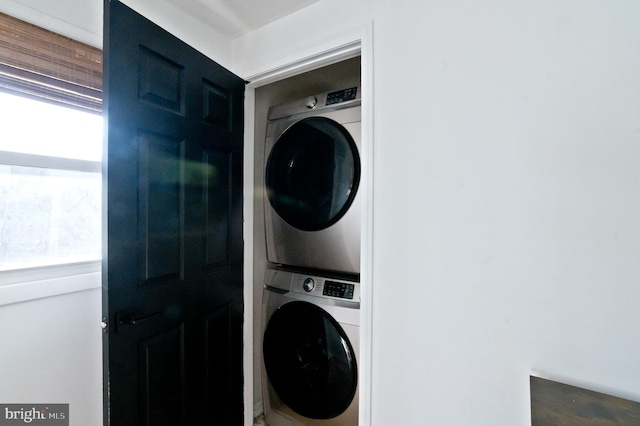 laundry room with laundry area and stacked washing maching and dryer