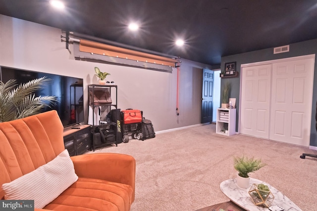 interior space featuring carpet floors, recessed lighting, visible vents, and baseboards