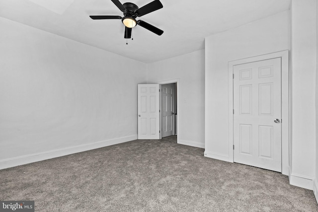 unfurnished bedroom featuring carpet, baseboards, and a ceiling fan