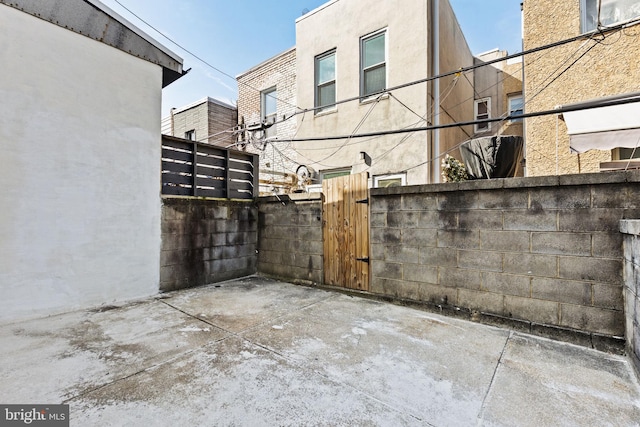 view of patio / terrace with fence and a gate