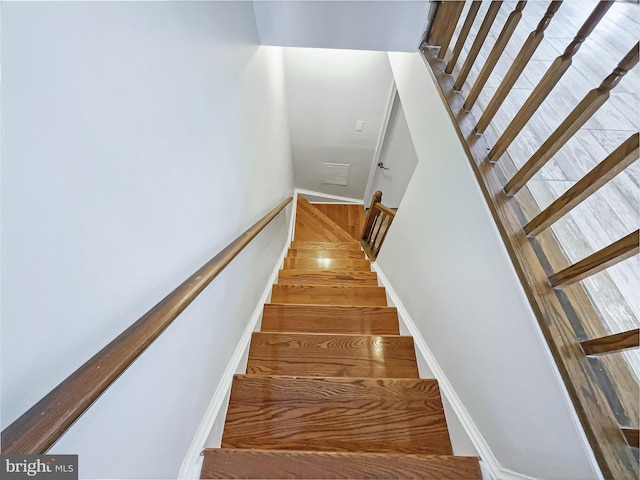 stairway featuring baseboards