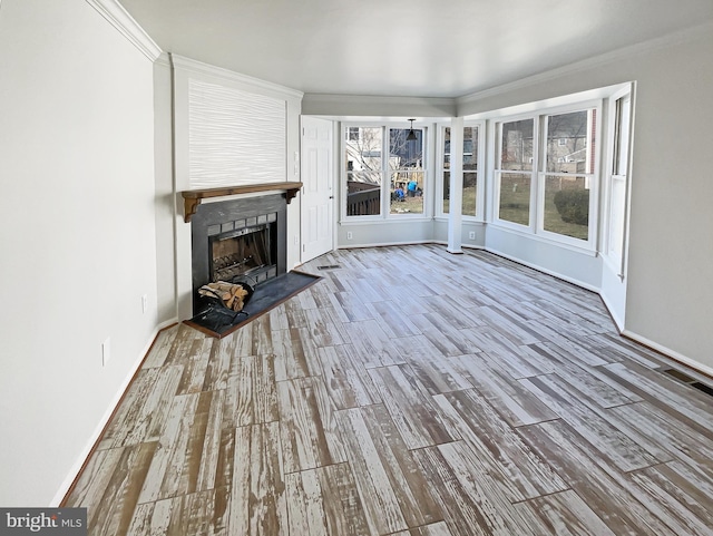 unfurnished sunroom featuring a fireplace