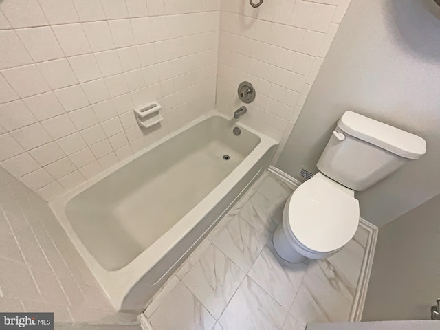 full bath with shower / washtub combination, marble finish floor, and toilet