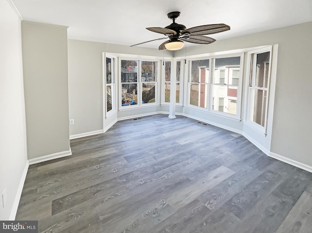 unfurnished sunroom with ceiling fan and visible vents