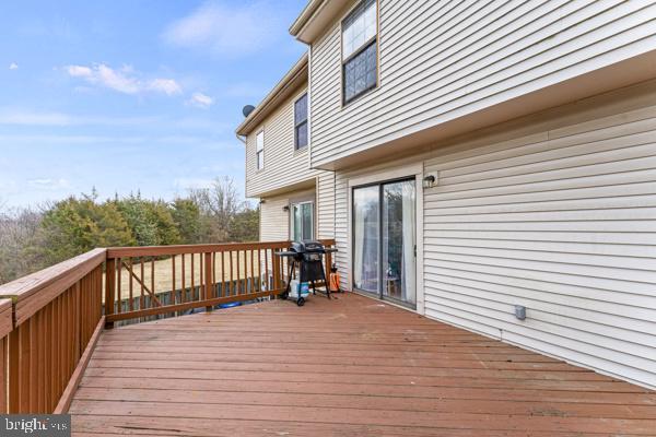 wooden deck featuring area for grilling