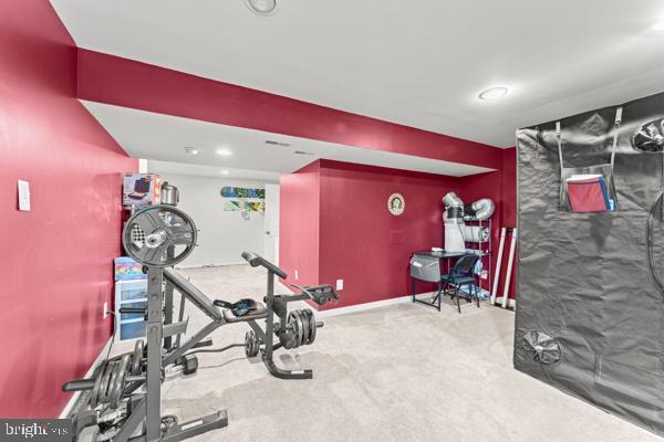 workout area with carpet and baseboards