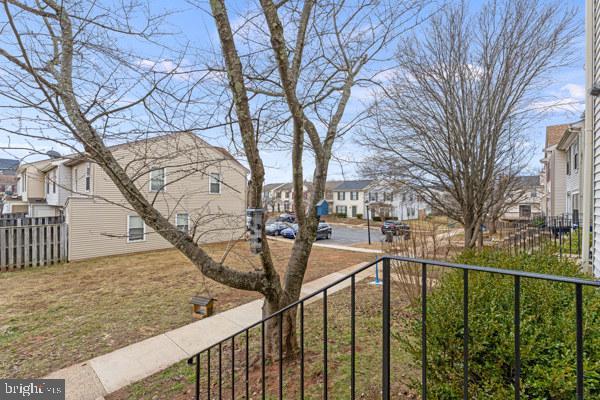 view of yard with a residential view and fence