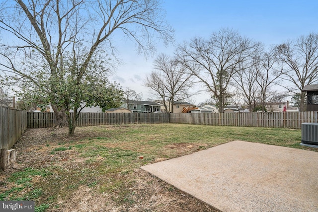 view of yard featuring a patio area, a fenced backyard, and central air condition unit