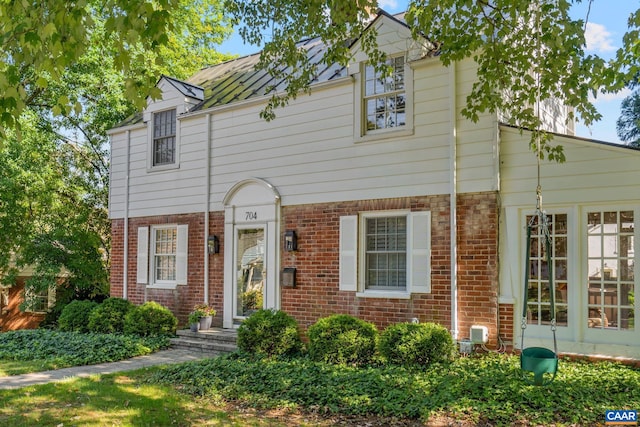 view of front of home featuring brick siding