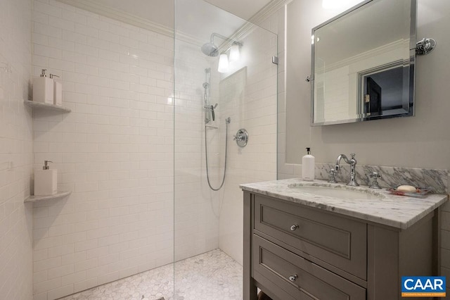 full bath featuring ornamental molding, vanity, and a walk in shower